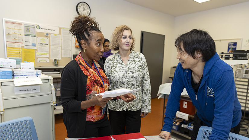 Dr. Chi joking with students