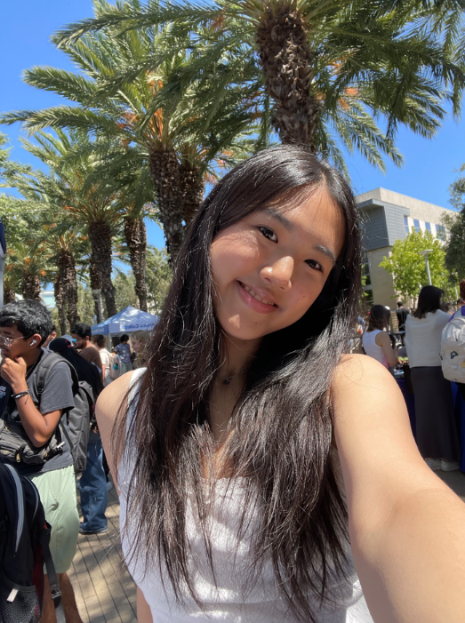 student selfie in front of palm trees